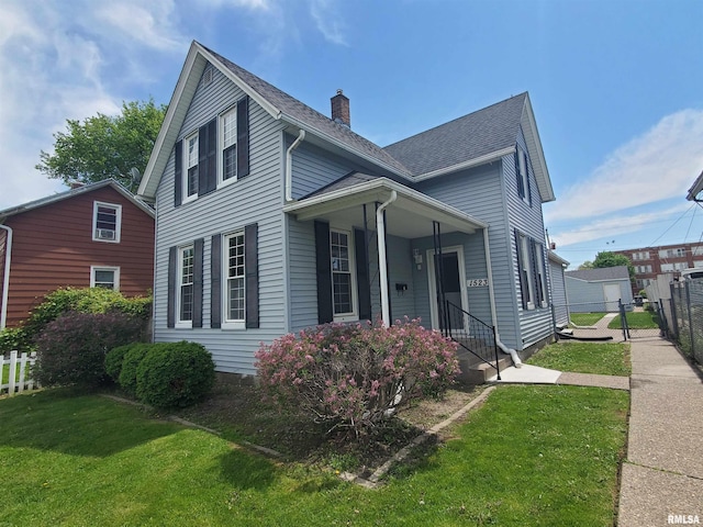 1523 W 13th St, Davenport, IA 52804 - traditional-style house with covered porch and roof with shingles