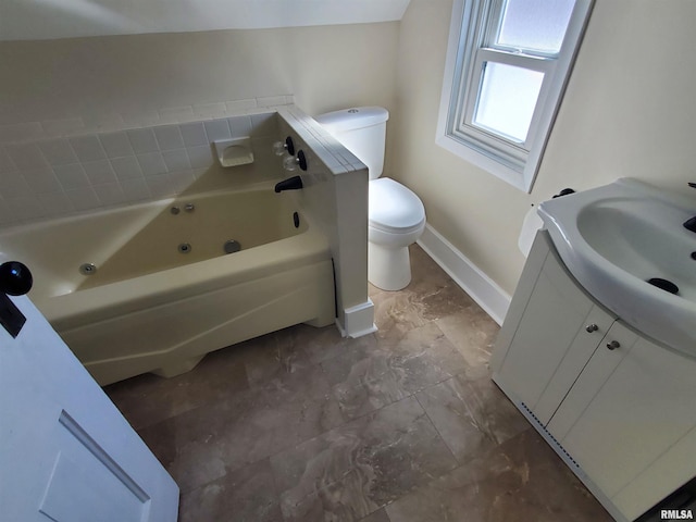 full bathroom with baseboards, toilet, a jetted tub, and vanity