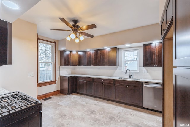 kitchen featuring visible vents, backsplash, dark brown cabinets, stainless steel dishwasher, and a sink