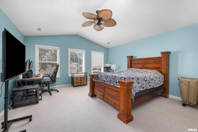 bedroom with visible vents, light carpet, lofted ceiling, a ceiling fan, and baseboards