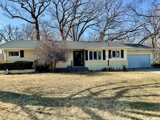 ranch-style house featuring a garage, brick siding, concrete driveway, and a front yard