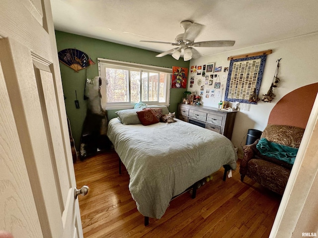 bedroom featuring a ceiling fan and wood finished floors