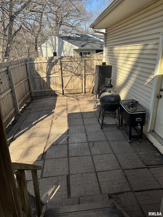 view of patio / terrace featuring fence and grilling area