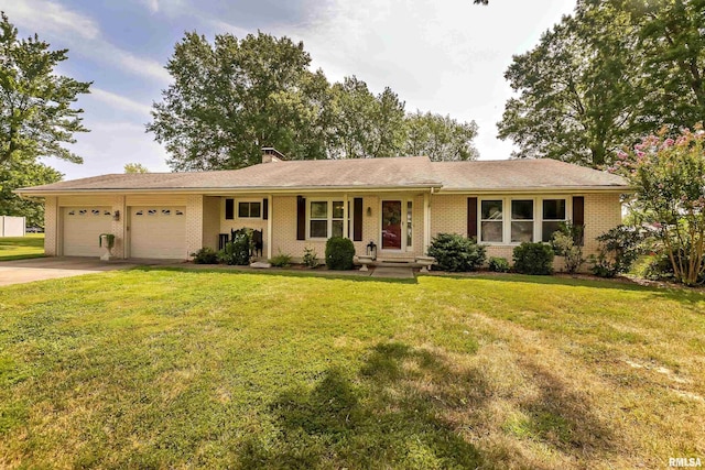 single story home featuring driveway, a front yard, a garage, brick siding, and a chimney