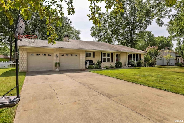 single story home with a front lawn, fence, concrete driveway, an attached garage, and brick siding