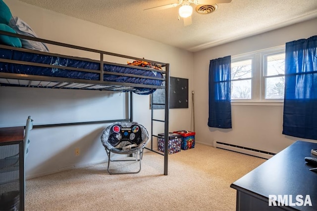 bedroom with a baseboard heating unit, carpet floors, a textured ceiling, and visible vents