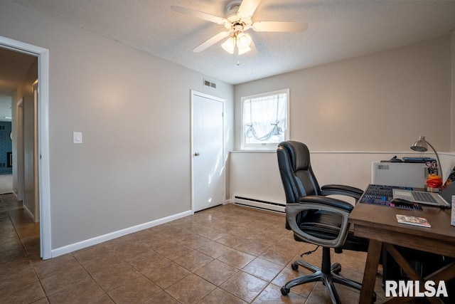 tiled office space featuring a ceiling fan, baseboards, visible vents, a textured ceiling, and baseboard heating