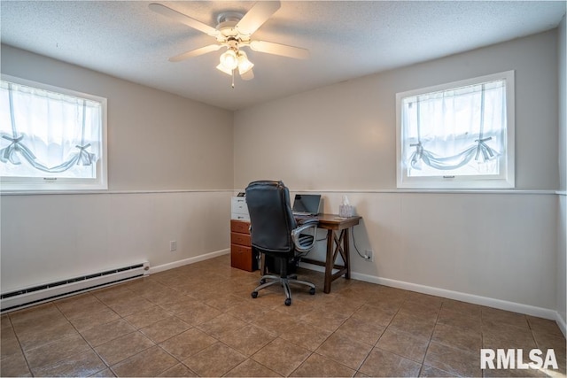 tiled office space with ceiling fan, baseboards, baseboard heating, and a textured ceiling