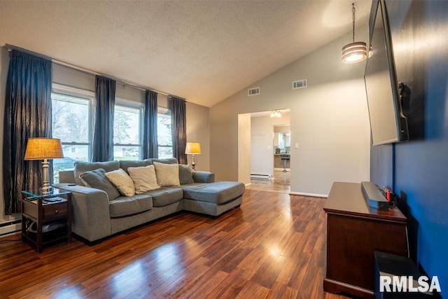 living area featuring visible vents, a textured ceiling, baseboard heating, and dark wood finished floors