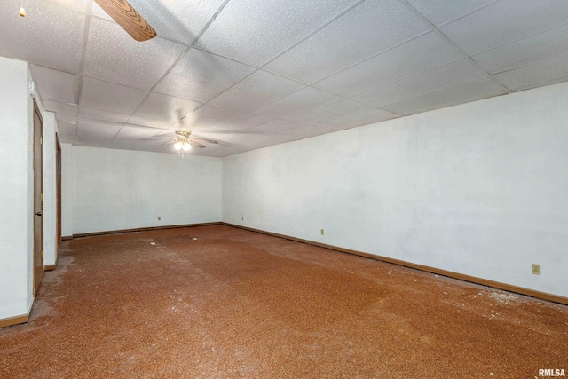 spare room with a drop ceiling, baseboards, and ceiling fan