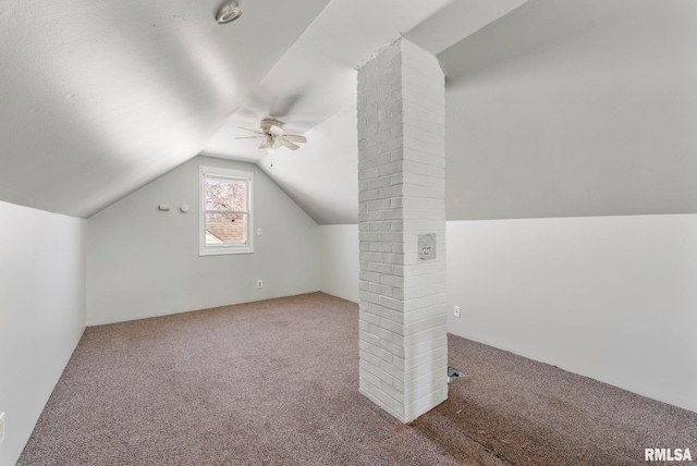 additional living space featuring lofted ceiling, a ceiling fan, and carpet floors