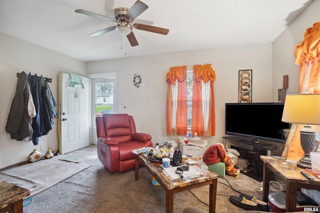 living room featuring carpet and ceiling fan