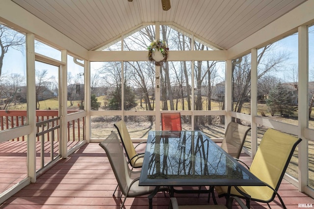 sunroom featuring lofted ceiling