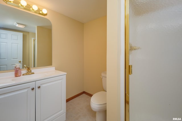 full bath featuring tile patterned flooring, baseboards, toilet, an enclosed shower, and vanity