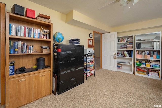 recreation room with carpet and a ceiling fan