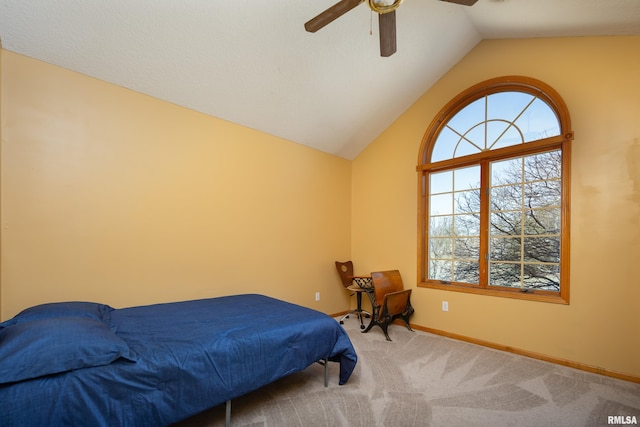 bedroom featuring baseboards, lofted ceiling, carpet floors, and ceiling fan