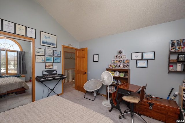 home office featuring a textured ceiling, high vaulted ceiling, and light carpet