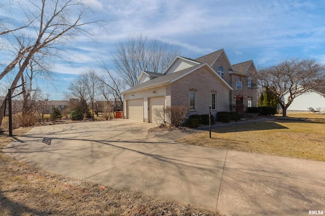 view of home's exterior with a yard, driveway, brick siding, and an attached garage