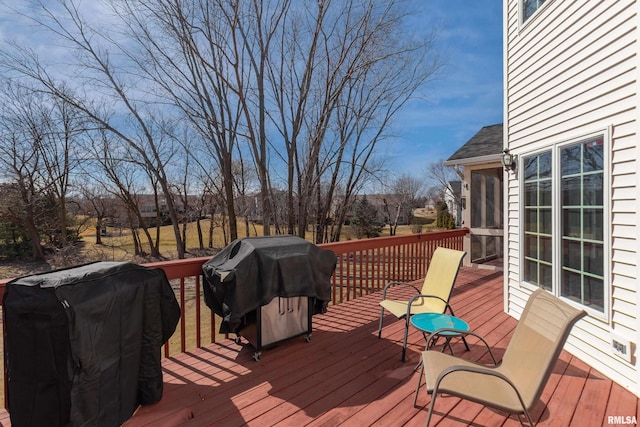 wooden deck featuring grilling area