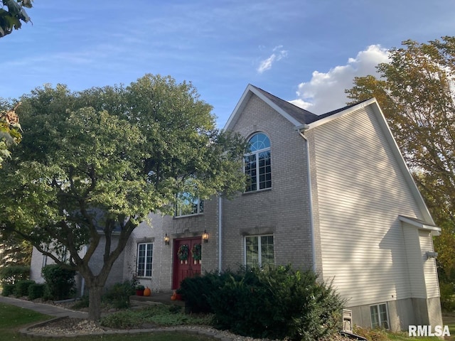 view of front of house with brick siding