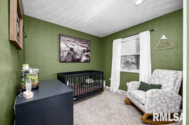 carpeted bedroom featuring baseboards