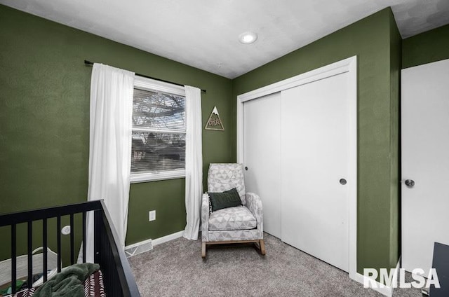 bedroom with a closet, baseboards, visible vents, and carpet floors