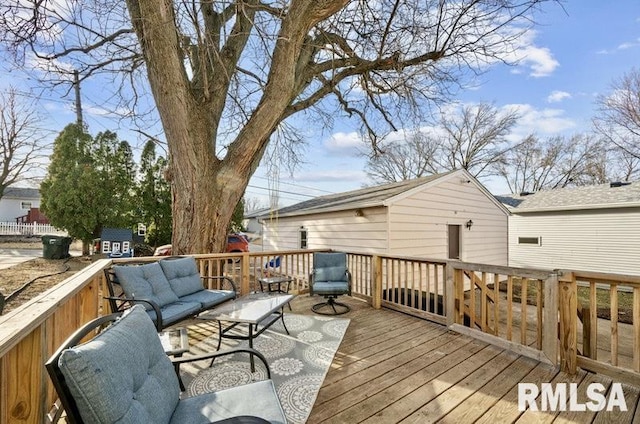 wooden deck with an outdoor living space