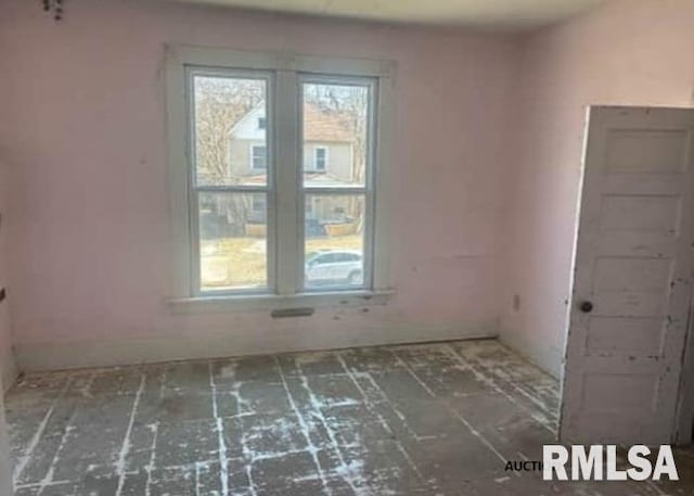 unfurnished room featuring a wealth of natural light