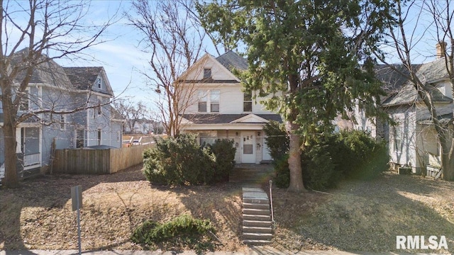 victorian home with fence