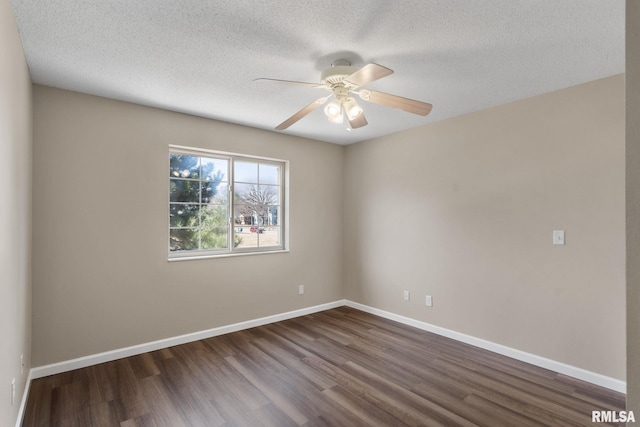 unfurnished room featuring baseboards, a textured ceiling, dark wood finished floors, and a ceiling fan