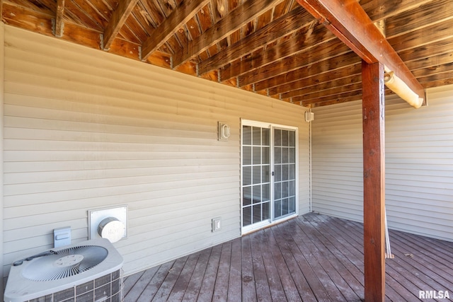 wooden terrace featuring cooling unit