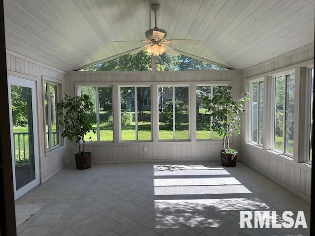 unfurnished sunroom with wood ceiling, a ceiling fan, and lofted ceiling