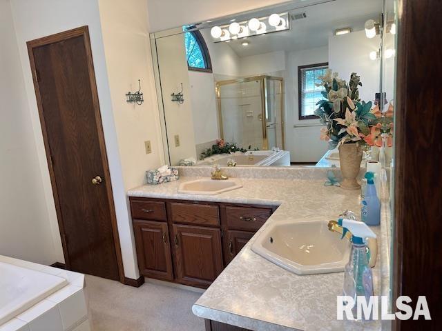 full bath featuring visible vents, a stall shower, vanity, and a bath