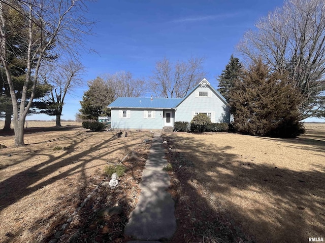 view of side of home featuring metal roof