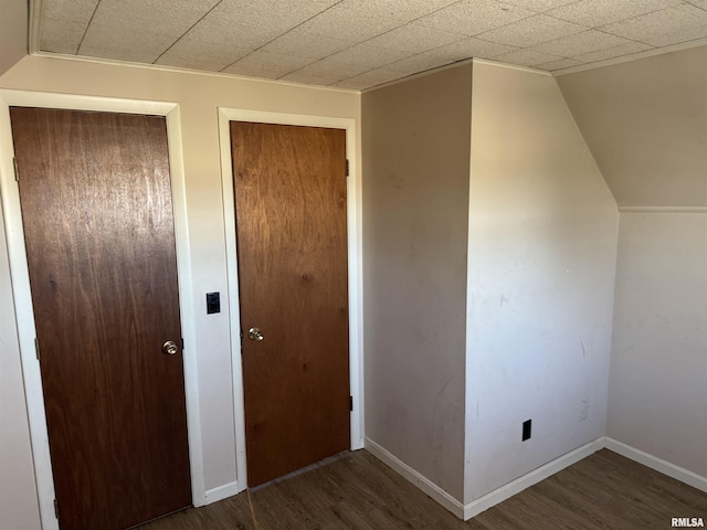 unfurnished bedroom with baseboards and wood finished floors