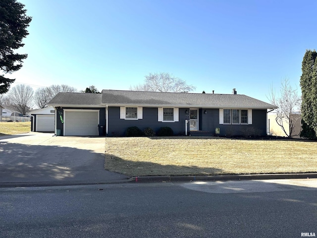 single story home with a front lawn, concrete driveway, and an attached garage