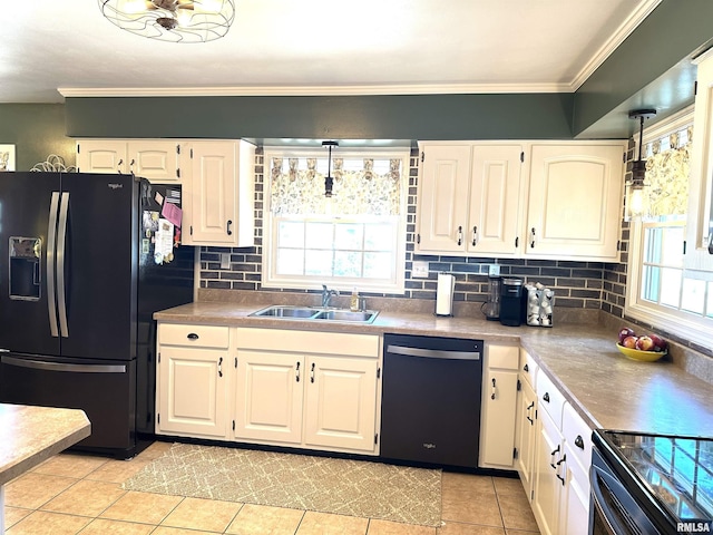 kitchen featuring ornamental molding, decorative backsplash, white cabinets, black appliances, and a sink