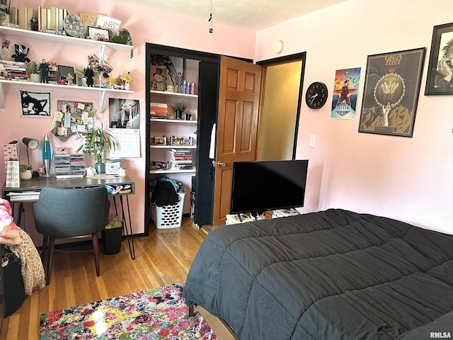 bedroom with light wood-style floors