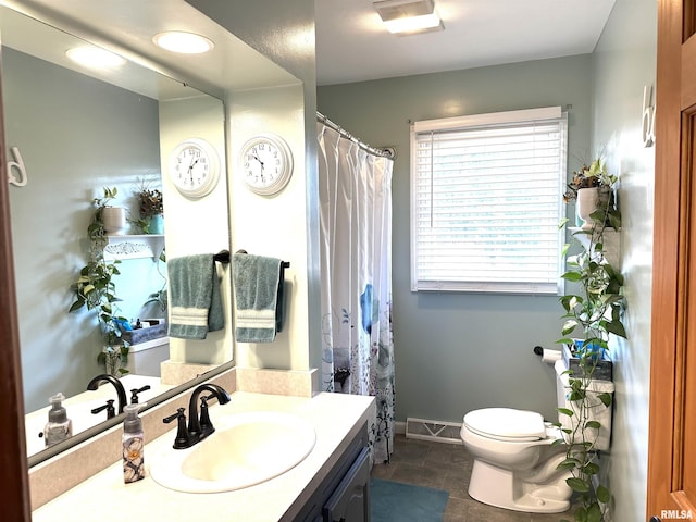 bathroom featuring vanity, a shower with shower curtain, baseboards, visible vents, and toilet