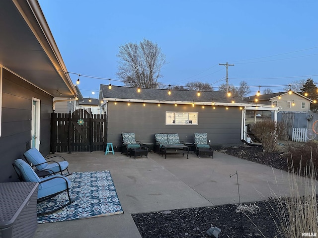 view of patio with an outdoor living space and fence