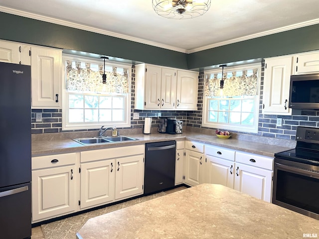 kitchen featuring a sink, crown molding, a healthy amount of sunlight, and stainless steel appliances