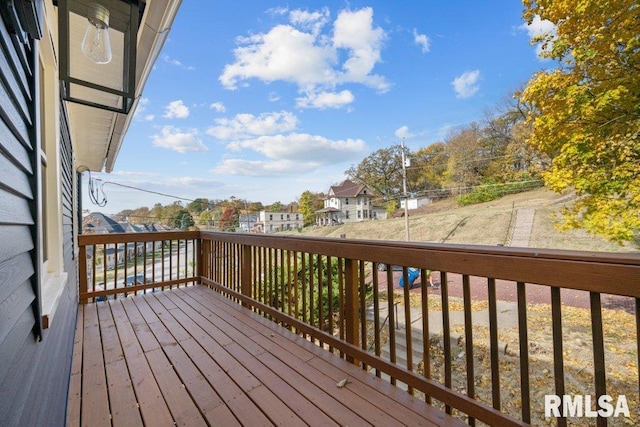 wooden deck featuring a residential view