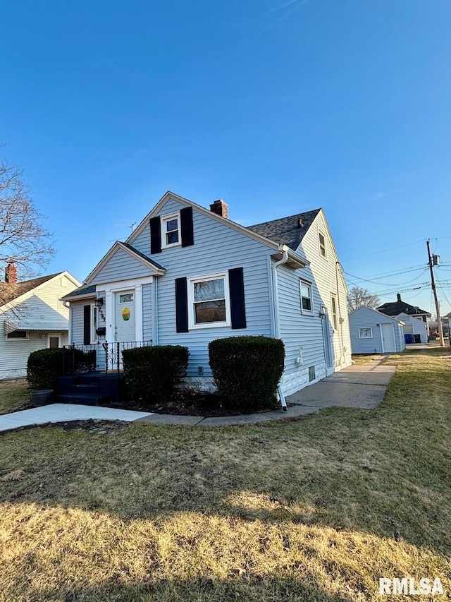 bungalow-style home with a front lawn and a chimney