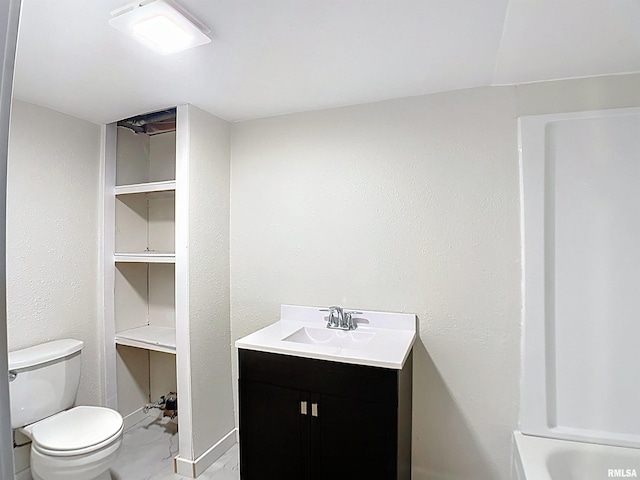 full bathroom featuring toilet and vanity