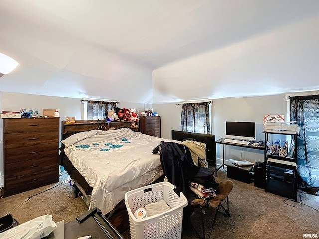 bedroom with vaulted ceiling and carpet