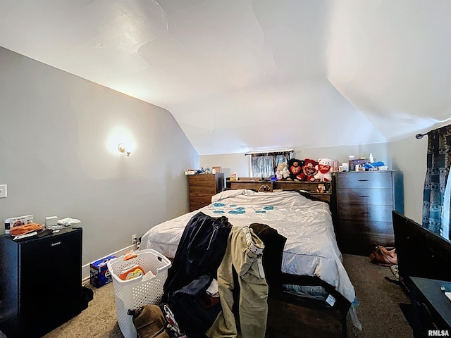 carpeted bedroom featuring vaulted ceiling