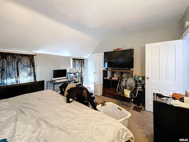 carpeted bedroom featuring vaulted ceiling