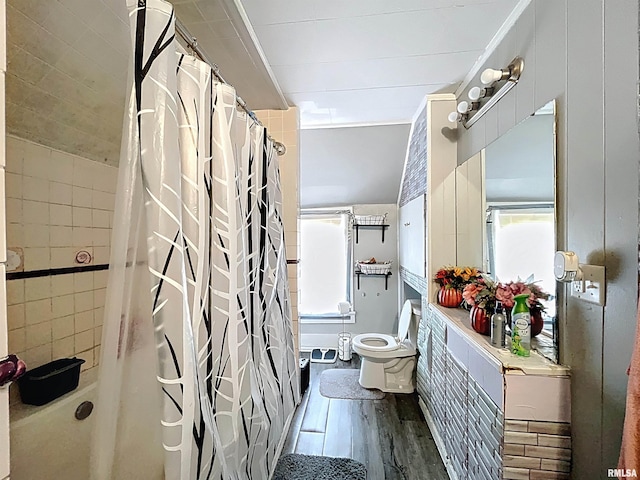 full bathroom featuring toilet and wood finished floors