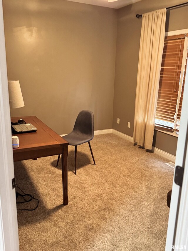 home office with baseboards and carpet