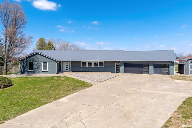 20874 270th St, Eldridge, IA 52748 - single story home featuring a garage, concrete driveway, and metal roof